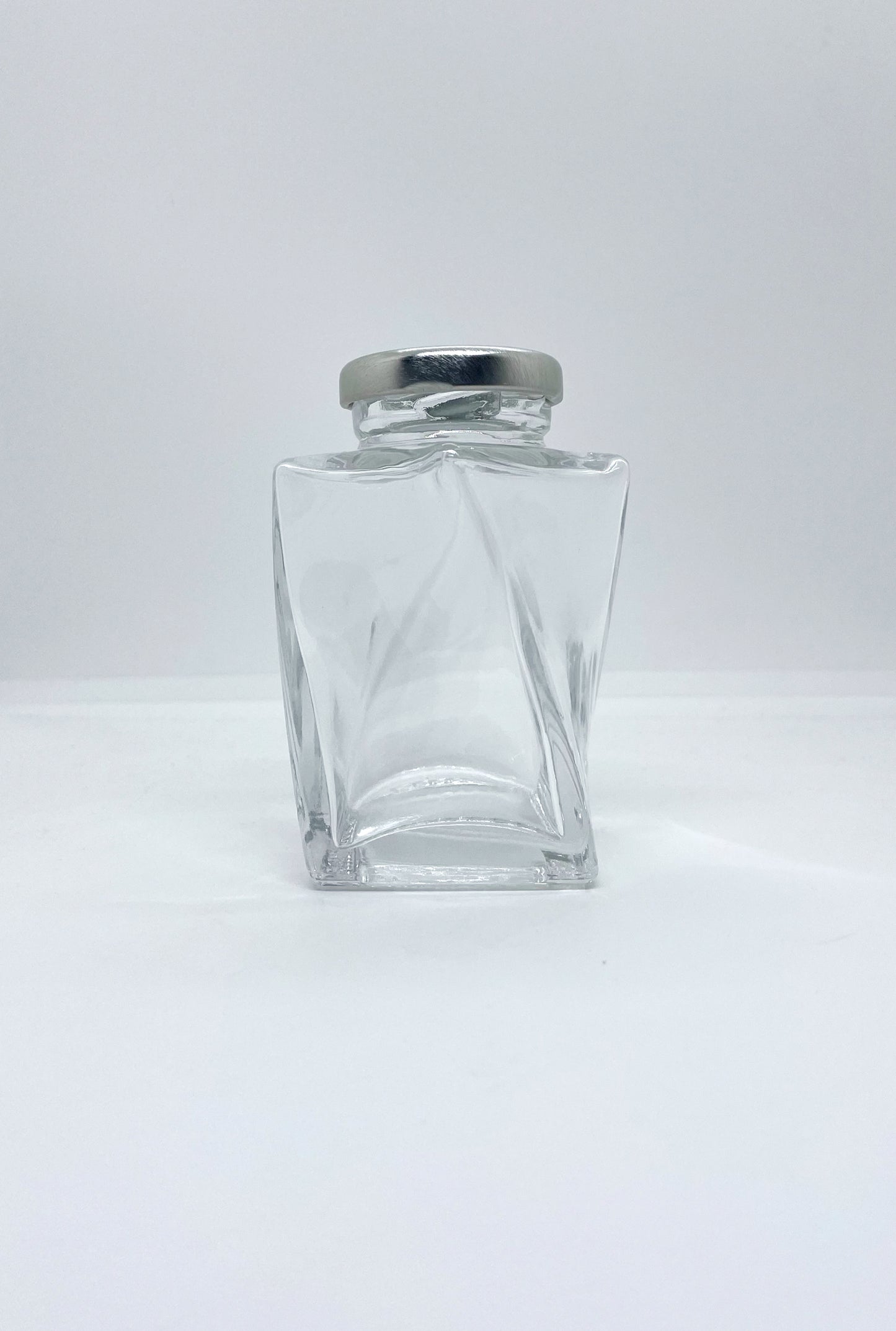 155mL. The Twist Glass Jar and Lid (Net Fill Capacity: 135mL.+/-)