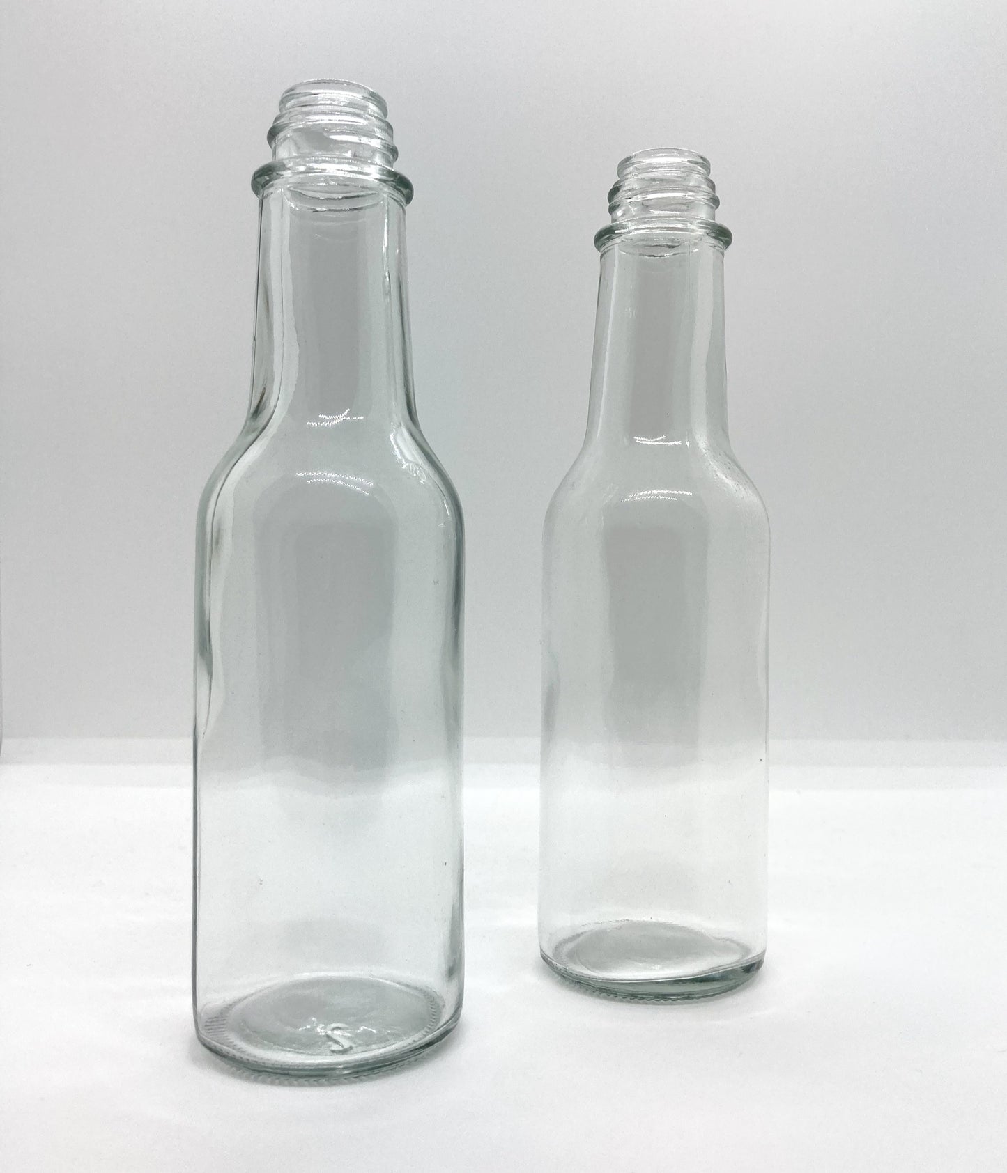 150mL. (Woozy Bottle) Clear Round Glass Bottle with Black Cap
