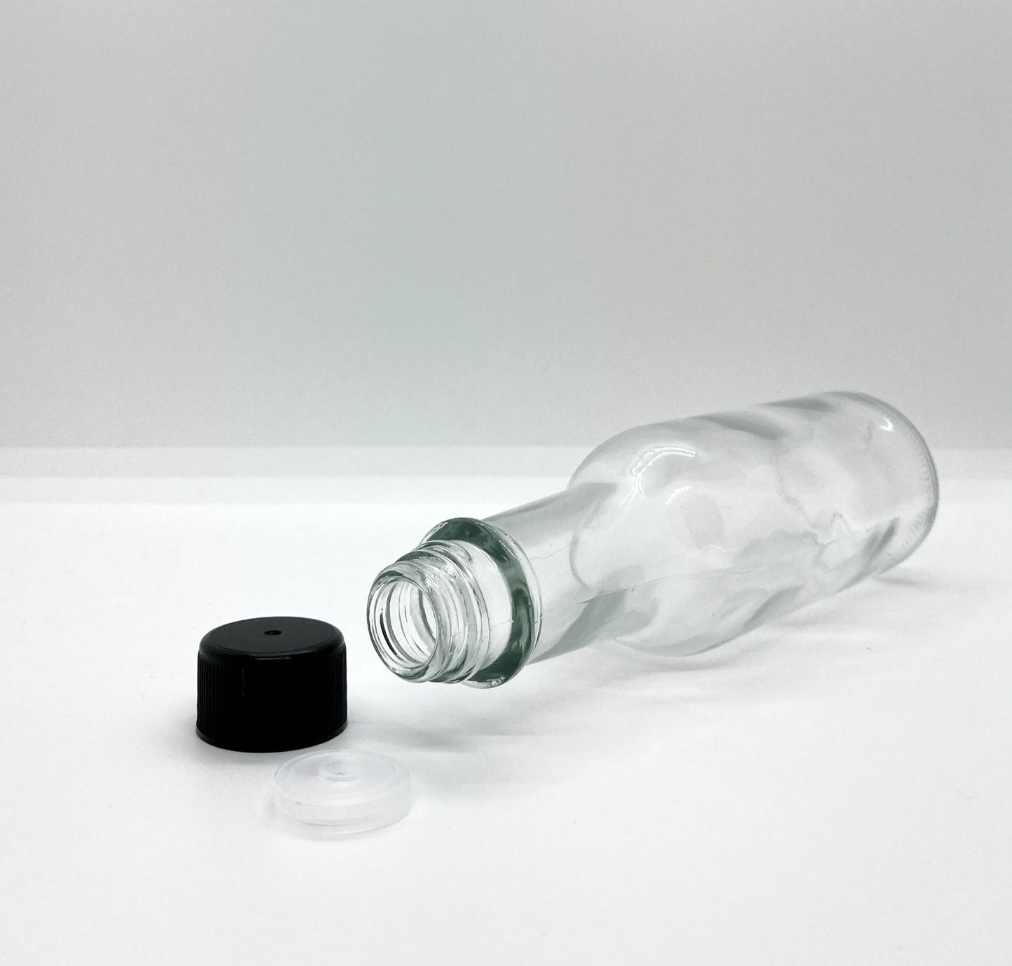 150mL. (Woozy Bottle) Clear Round Glass Bottle with Black Cap
