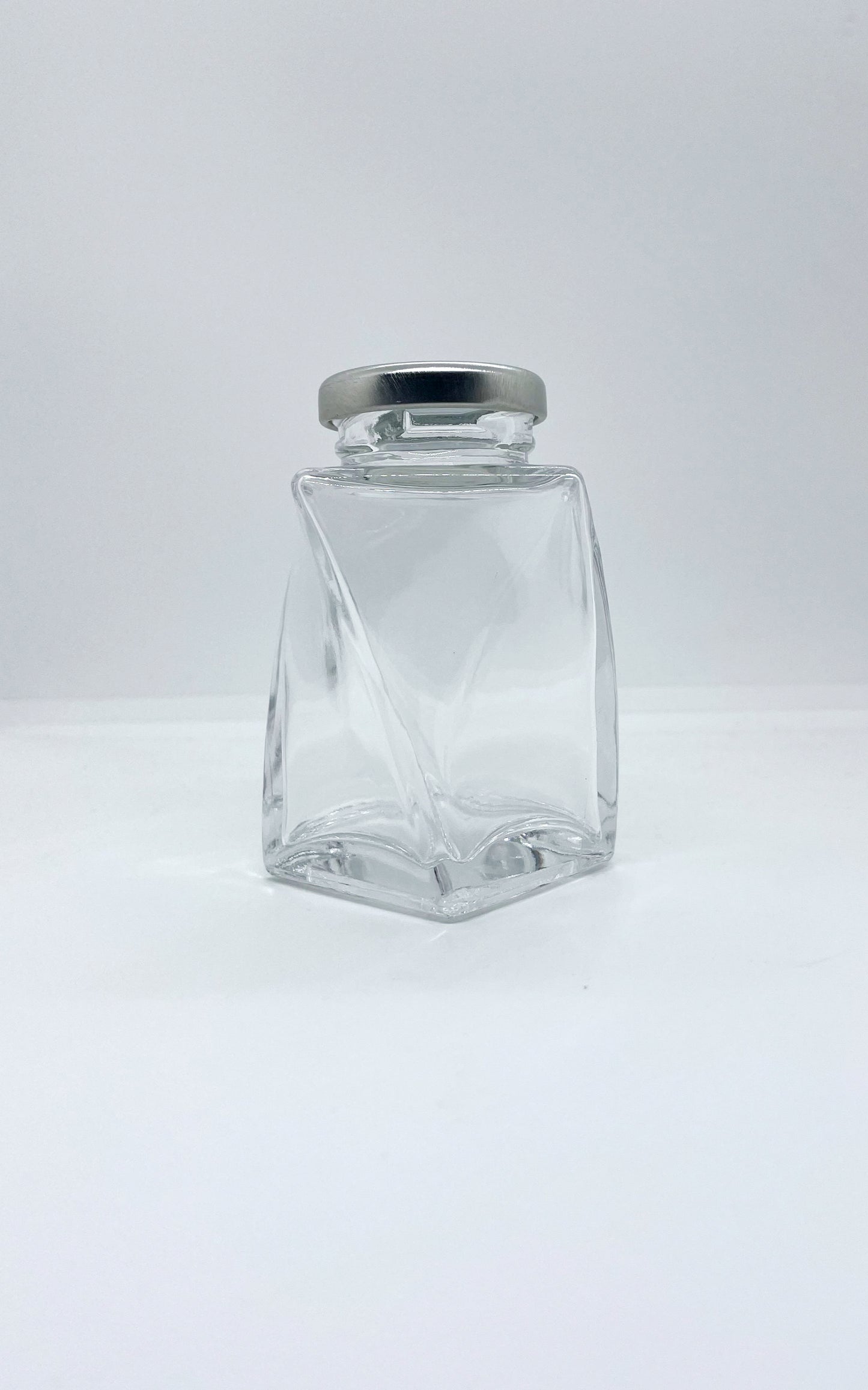 155mL. The Twist Glass Jar and Lid (Net Fill Capacity: 135mL.+/-)